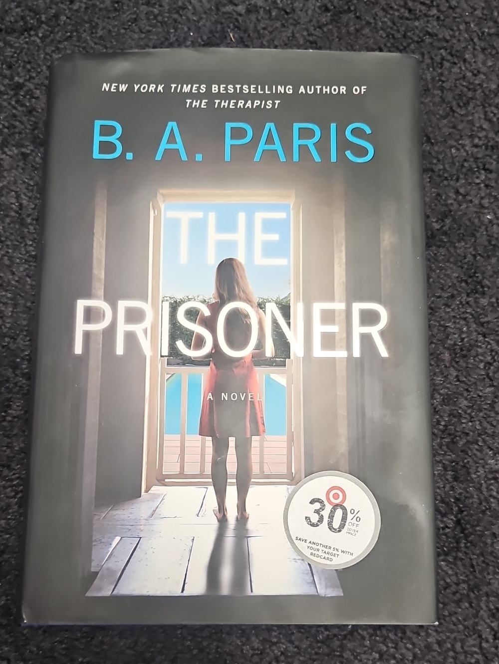 The Prisoner by B.A. PARIS - Hardcover Novel in Black and Blue Cover